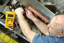 Experienced technician repairing equipment